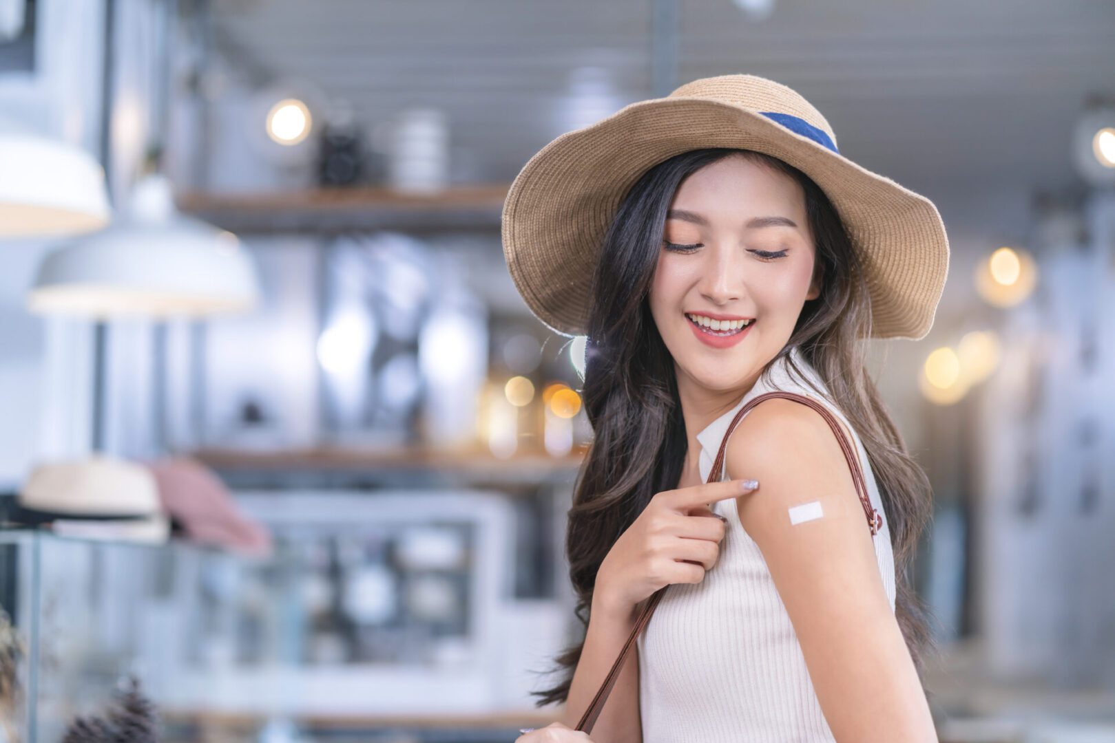 Asian female cheerful smiling teenager hand gesture point show vaccine brand against covid-19 with happiness healthy after getting vaccine prevent Asian female cheerful smiling teenager hand gesture point show vaccine brand against covid-19 with happiness healthy after getting vaccine prevent